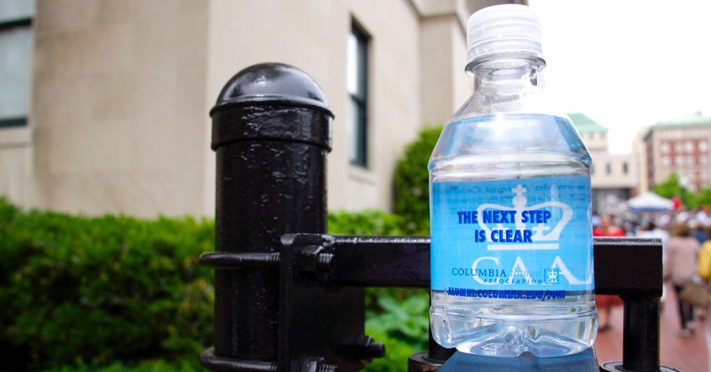 CAA water bottle on campus with the text "The Next Step Is Clear" and the CAA Crown printed on it.