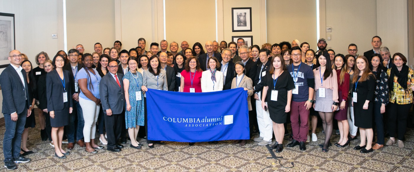 Alumni Leaders holding Columbia Alumni Association Banner