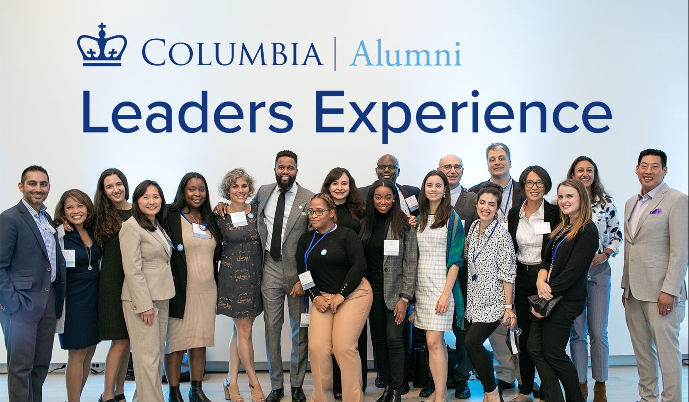 Alumni in front of Columbia Alumni Leaders Experience Logo