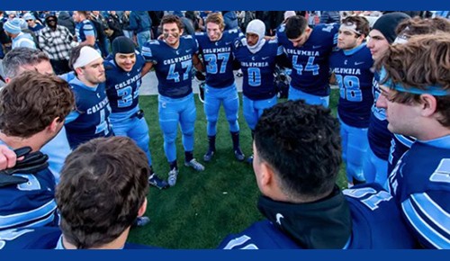 Columbia Lions in a football huddle