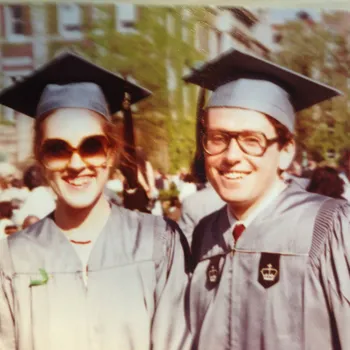Man and a woman wearing Columbia regalia