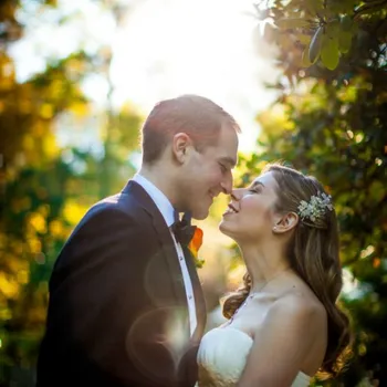 Groom and Bride about to kiss on their wedding day.