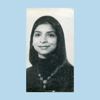 Black and white photo of young women with a big smile and straight hair.