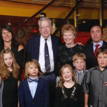 Older couple surrounded by children and grandchildren
