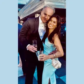 Male and female couple in formal wear embracing