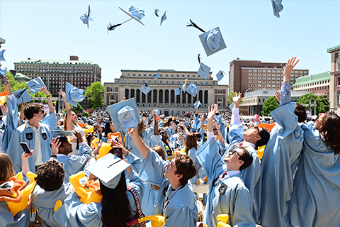 Grads throwing hats