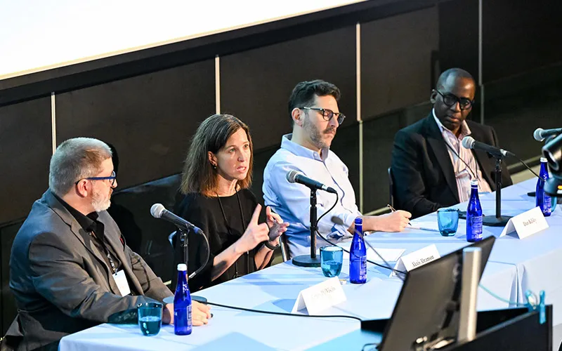 Break-out panels session with speakers at a table.