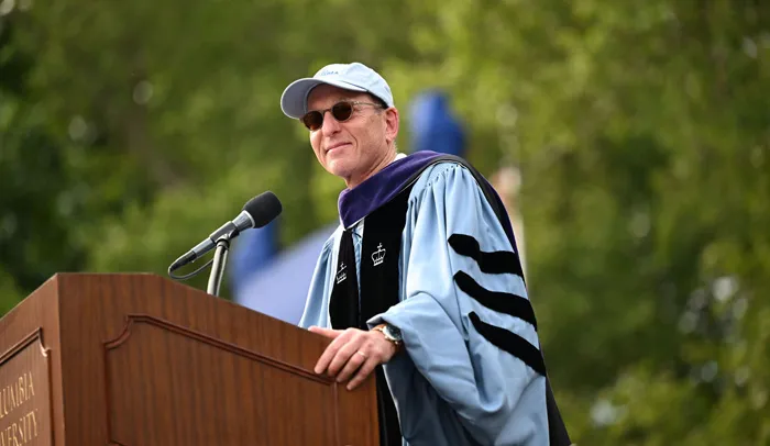 Lanny Breuer at the podium during commencement.