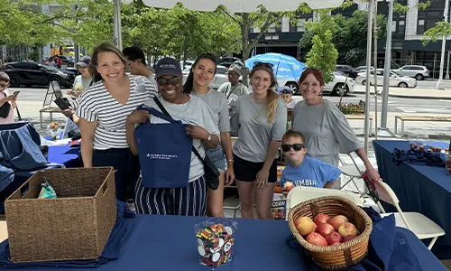 Columbia Alumni team at the Community Day booth
